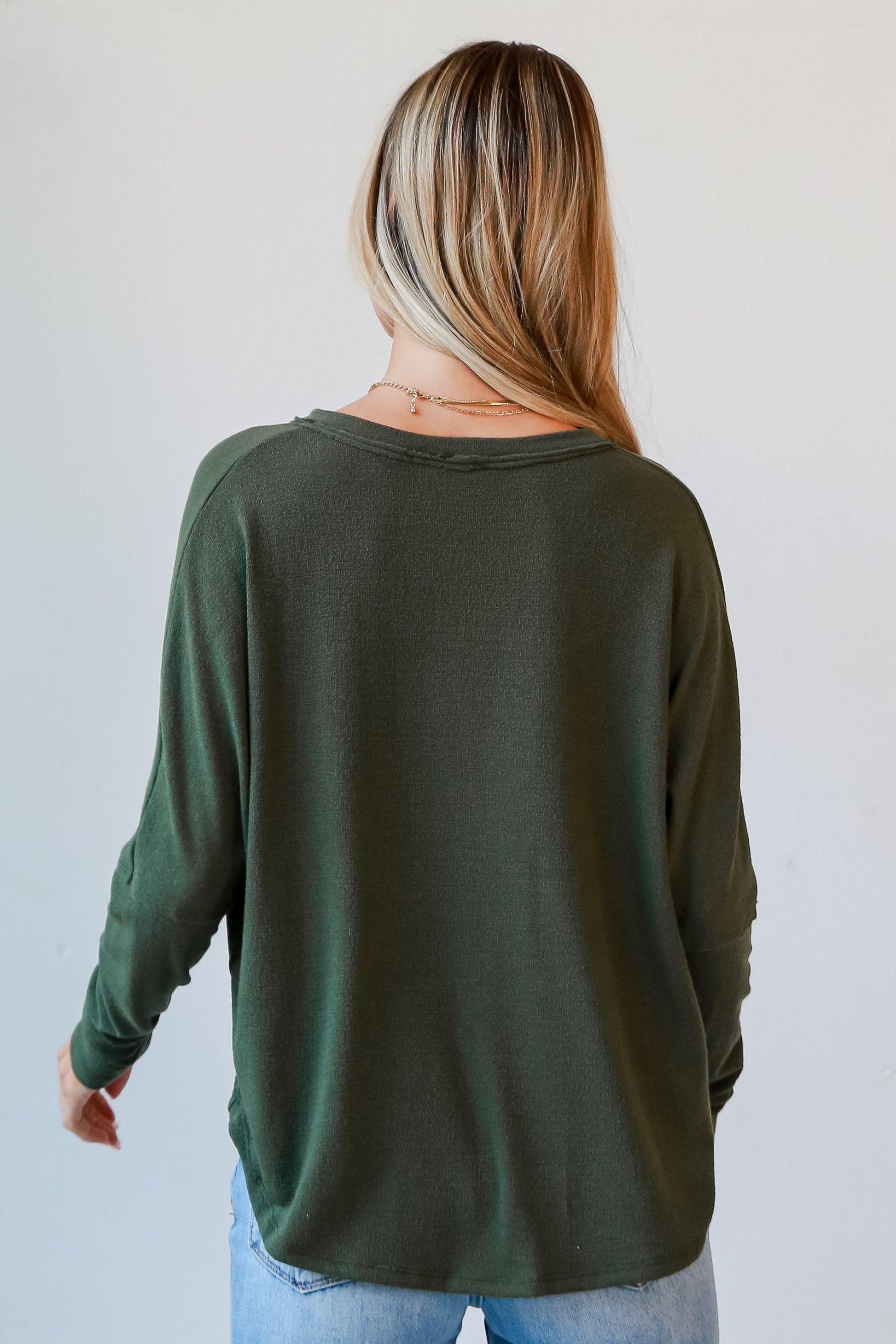 green knit top